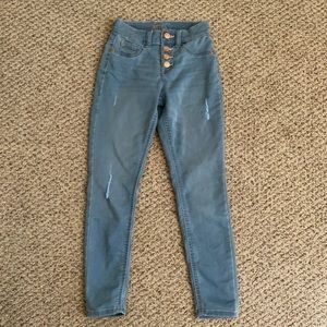 Justice ripped jeans. 4 stacked bronze buttons. Blue grey color.